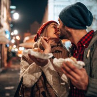 eating street food at the christmas markets in italy - junk food stock pictures, royalty-free photos & images