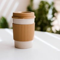 eco-friendly cup for hot drinks on white table with space for text - junk food stock pictures, royalty-free photos & images