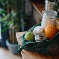 eco bag on kitchen counter with food in jars and fresh fruits. zero waste concept - food stock pictures, royalty-free photos & images