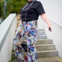 elderly woman, fashion portrait and stairs with sunglasses, jewellery and trippy disco clothes. urban senior fashionista, smartphone and influencer in city for jewelry, trendy and happy for web blog - fashion stock pictures, 