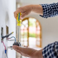 electrician installing a power outlet while remodeling a house - home decoration stock pictures, royalty-free photos & images