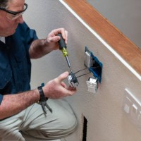 electrician installing light switch in home - home decoration stock pictures, royalty-free photos & images