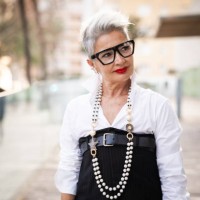 elegant businesswoman is walking in the city during her coffee break - fashion stock pictures, royalty-free photos & images