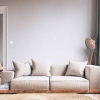 elegant living room with beige sofa and decoration and a peek of next room - fashion stock pictures, royalty-free photos & images