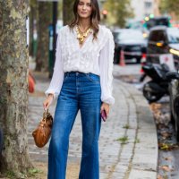 Ellinor Malecaze wears white blouse, golden necklace, denim jeans, brown bag, clogs outside Chloe during Womenswear Spring/Summer 2025 as part of...