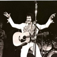 Elvis Presley performs in concert at the Milwaukee Arena on April 27, l977 in Milwaukee, Wisconsin.