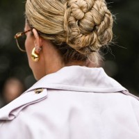 Emili Sindlev is seen wearing an ivory trench coat, pink shirt, black tie, pink pants and black Hermes bag outside the Zimmermann show during the...