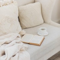 empty couch with beautiful pillow, tea cup and book. - home decoration stock pictures, royalty-free photos & images