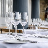 empty table seen from side on terrace of restaurant - home decoration stock pictures, royalty-free photos & images