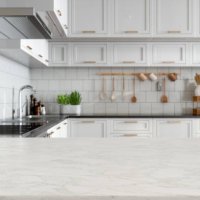 empty white marble countertop with blurred kitchen background - food stock pictures, royalty-free photos & images