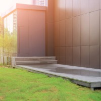 empty wooden platform and grass land outside of the modern office building,guangzhou,guangdong,china. - garden decoration stock pictures, royalty-free photos & images