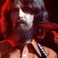 English musician, singer, songwriter, music and film producer and lead guitarist for the Beatles, George Harrison performs at his Concert For...
