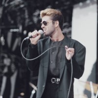 English singer, songwriter and musician, George Michael performs live on stage at the Nelson Mandela 70th Birthday Tribute concert at Wembley Stadium...