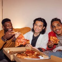 enjoying a pizza together - junk food stock pictures, royalty-free photos & images