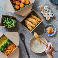 enjoying assorted takeaway meal at home - junk food stock pictures, royalty-free photos & images