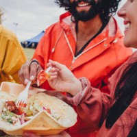 enjoying the food at a music festival - food stock pictures, royalty-free photos & images