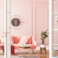 entrance of living room with pink sofa, potted plant and coffee table - home decoration stock pictures, royalty-free photos & images
