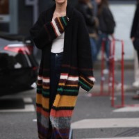 Eva Chen is seen wearing a white shirt, black cardigan with yellow, green, white and orange stripes, denim blue jeans, black shoes outside Dries Van...