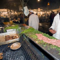 Evening barbecue food stall Place Djemaa El Fna Marrakech Morocco.