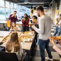 everybody looks so hungry after busy day at work - junk food stock pictures, royalty-free photos & images