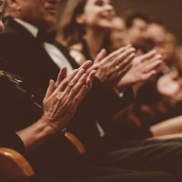 excited audience clapping in the theater, focus on hands - concert stock pictures, royalty-free photos & images