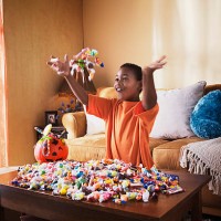 excited boy with halloween candy - junk food stock pictures, royalty-free photos & images