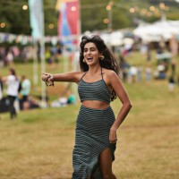 excited woman running at music festival - concert stock pictures, royalty-free photos & images