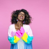 excited woman wearing rainbow cardigan - fashion stock pictures, royalty-free photos & images