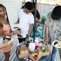 extended family reuniting together for meal - junk food stock pictures, royalty-free photos & images