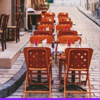 exterior of cafe with tables and chairs on street alongside stone wall, france - garden decoration stock pictures, royalty-free photos & images