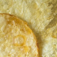 extreme close up textured and edge of potato chip - food stock pictures, royalty-free photos & images