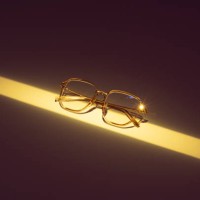eyeglasses illuminated by a long strip of neon yellow light - fashion stock pictures, royalty-free photos & images