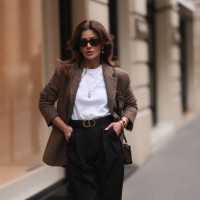 Füsun Lindner seen wearing Arket brown / black checked blazer jacket, black sunglasses, COS white cotton t-shirt, COS black wide leg pants, Ole...