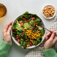 faceless female eating healthy vegan plant-based salad in bowl with fatty acids and dietary fiber - food stock pictures, royalty-free photos & images