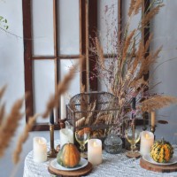 fall decor halloween style table serve with candles, pampas grass, reeds, pumpkins. rustic style - home decoration stock pictures, royalty-free photos & images