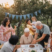 family and friends enjoying at a party in garden - garden decoration stock pictures, royalty-free photos & images