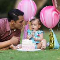 family celebrating baby's first birthday outside at home during pandemic - garden decoration stock pictures, royalty-free photos & images