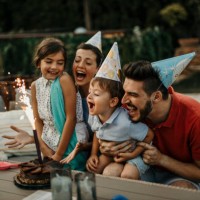 family celebrating the birthday of the little son together - garden decoration stock pictures, royalty-free photos & images