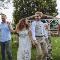 family dancing together at a summer garden party. - garden decoration stock pictures, royalty-free photos & images