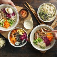 family eating homemade poke bowls and glass noodle salad - junk food stock pictures, royalty-free photos & images
