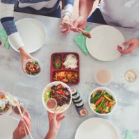 family eating take out food at home. - junk food stock pictures, royalty-free photos & images