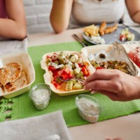 family eating takeaway meals at home - junk food stock pictures, royalty-free photos & images