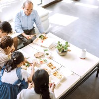 family eating takeout food at home - junk food stock pictures, royalty-free photos & images