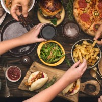 family enjoying a dinner together - food stock pictures, royalty-free photos & images
