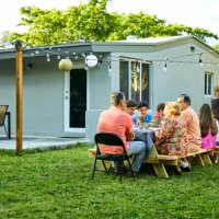 family enjoying birthday party at back yard - garden decoration stock pictures, royalty-free photos & images