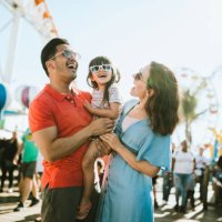 family has fun at outdoor carnival setting - travel stock pictures, royalty-free photos & images