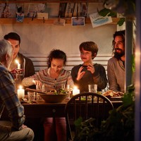 family having cozy dinner en garden house - food stock pictures, royalty-free photos & images