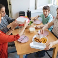 family having delivered food for lunch amidst stay at home order - junk food stock pictures, royalty-free photos & images