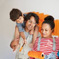 family having fun while renovating home together - home decoration stock pictures, royalty-free photos & images