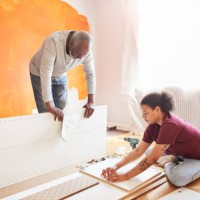 family installing furniture at home - home decoration stock pictures, royalty-free photos & images